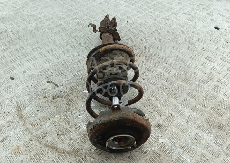 Амортизатор передний левый